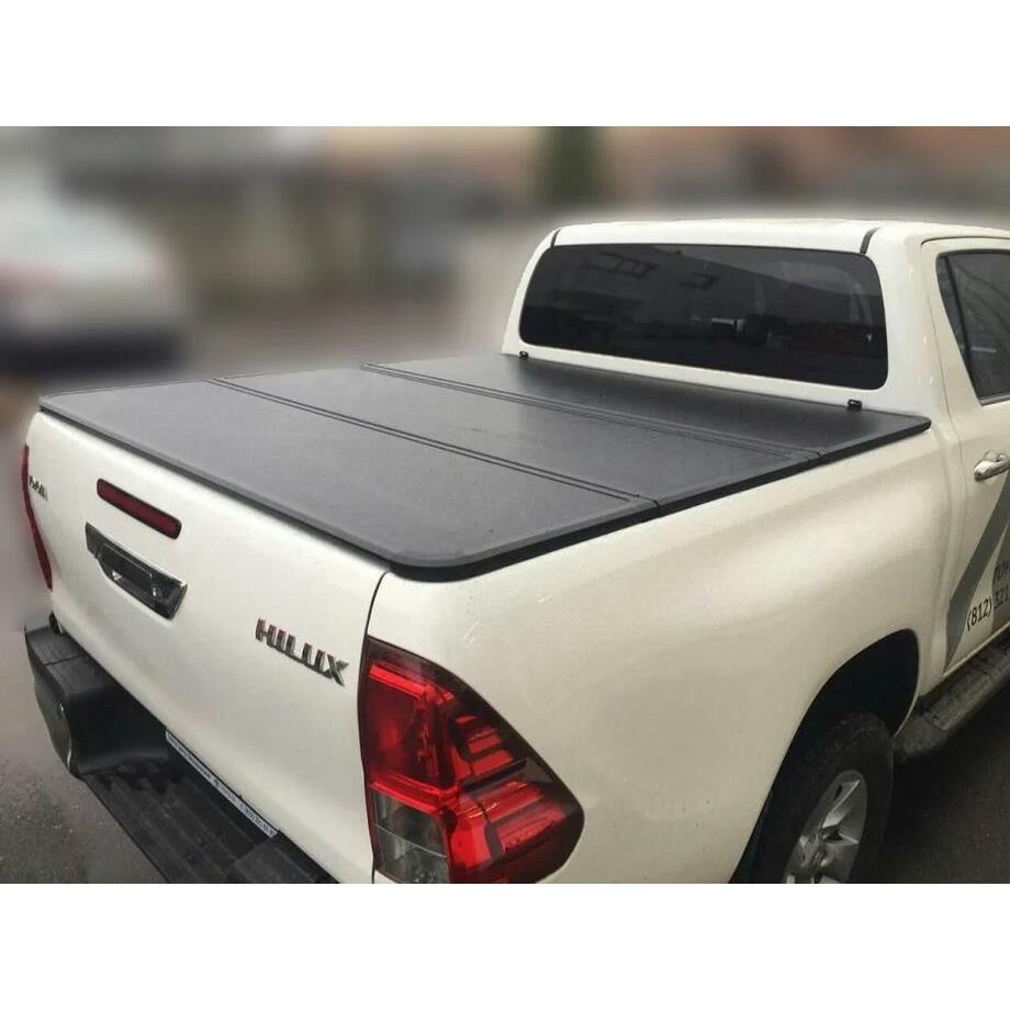 Крышка алюминиевая четырехсекционная Winbo на Toyota Hilux Revo (2015-2021)